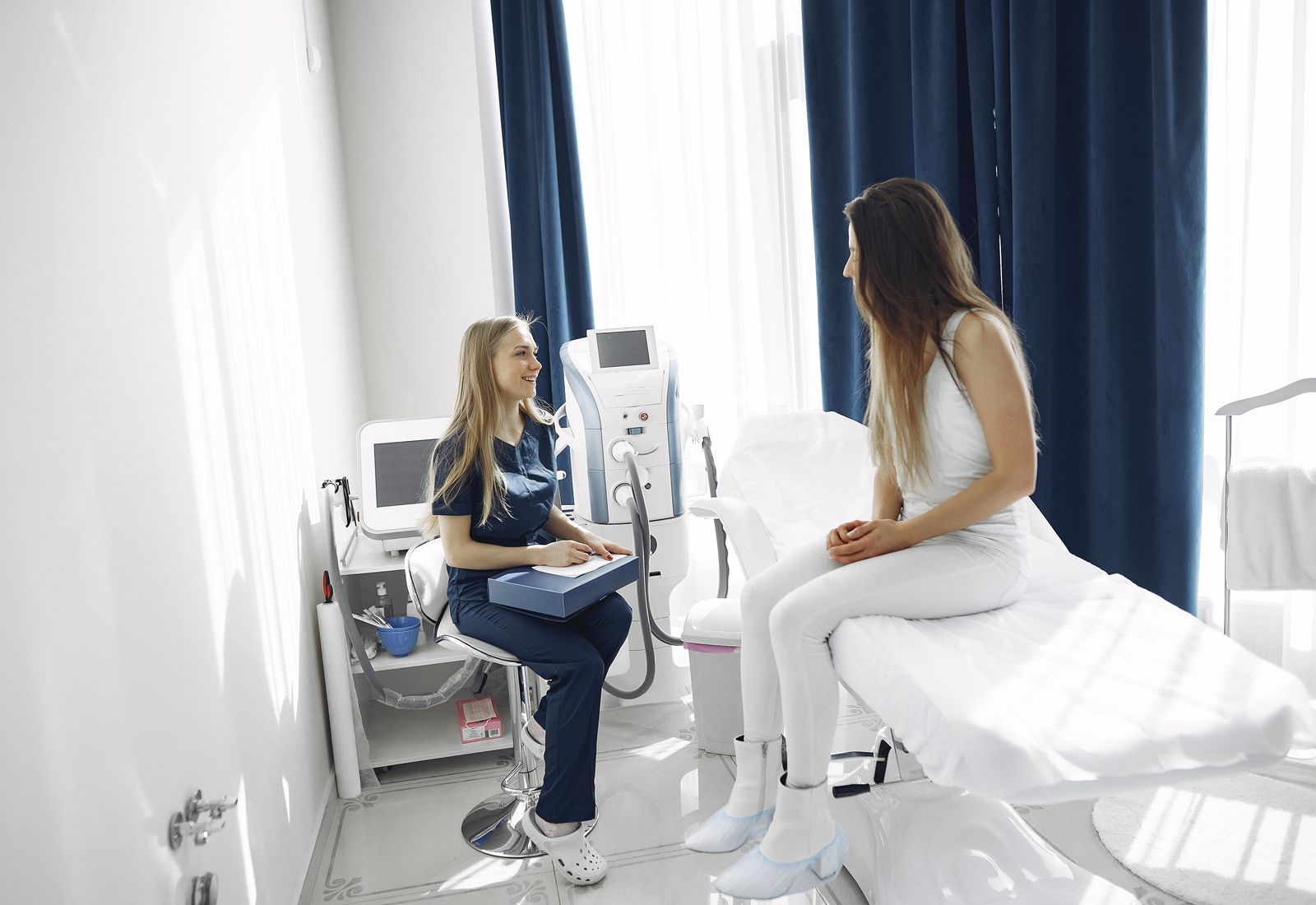 Practitioner and client in a modern med spa treatment room