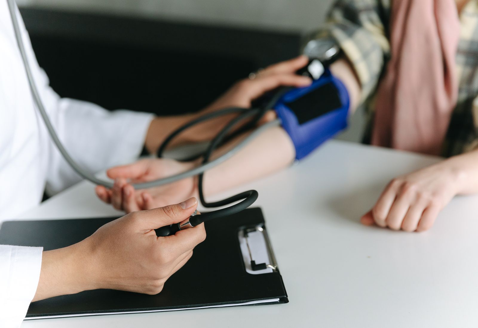 Physical therapist applying kinesiology tape to a patient